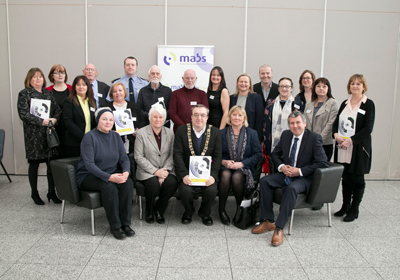 Pictured standing are Board members and staff of Dublin 10 & 20 MABS with staff from Clondalkin and Dundrum MABS and National Traveller MABS. Seated from left are: Brid Smith T.D., Catherine Byrne T.D. Minister of State at the Department of Health, Lord Mayor of Dublin, Michael Mac Donncha, Angela Black, Chief Executive, CIB and Dr Stuart Stamp, Report Author.